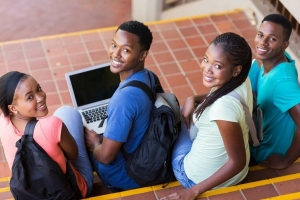 group of happy college students looking back